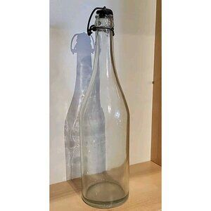 Glass Bottle With Metal Fastener Top 12 Inches With Some Bubbling In The Glass.